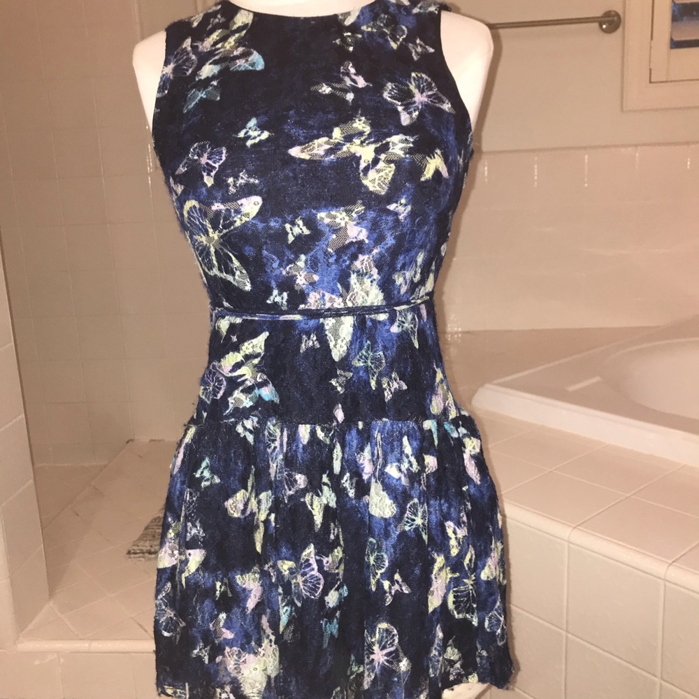 Super cute lace dress with butterfly details.